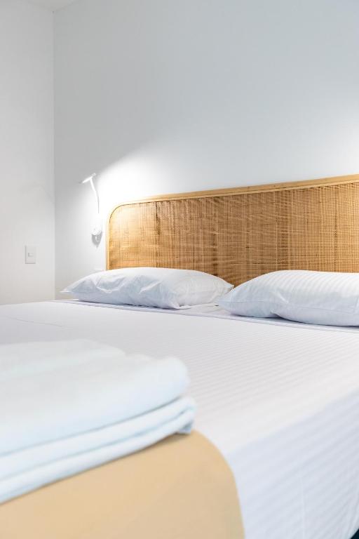 Postel nebo postele na pokoji v ubytování SUUT Hostal Boutique