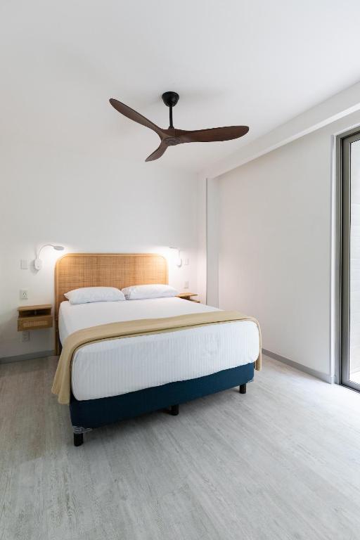 Postel nebo postele na pokoji v ubytování SUUT Hostal Boutique