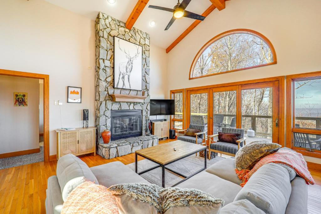 a living room with a couch and a fireplace at Deck, Fire Pit and Game Room Beech Mountain Retreat in Beech Mountain
