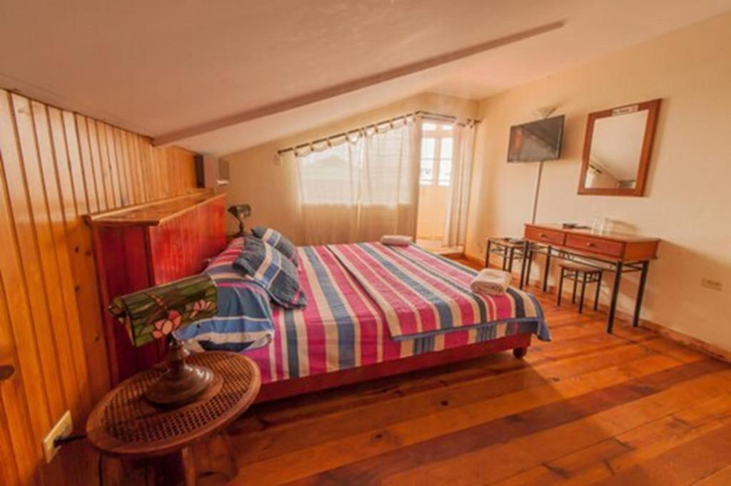 Una cama o camas en una habitación de Hotel Posada Los Delfines