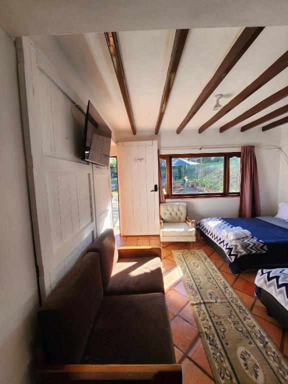 Postel nebo postele na pokoji v ubytování Hotel Ficus Villa de Leyva