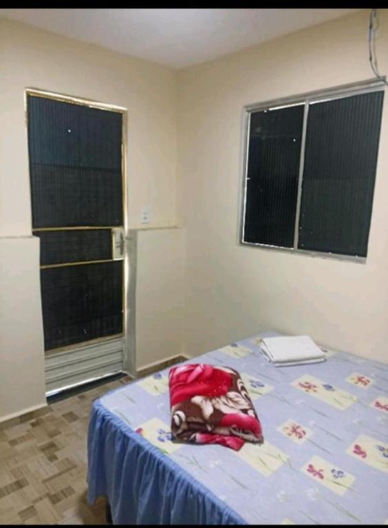 Postel nebo postele na pokoji v ubytování Dani Hostel e Suítes