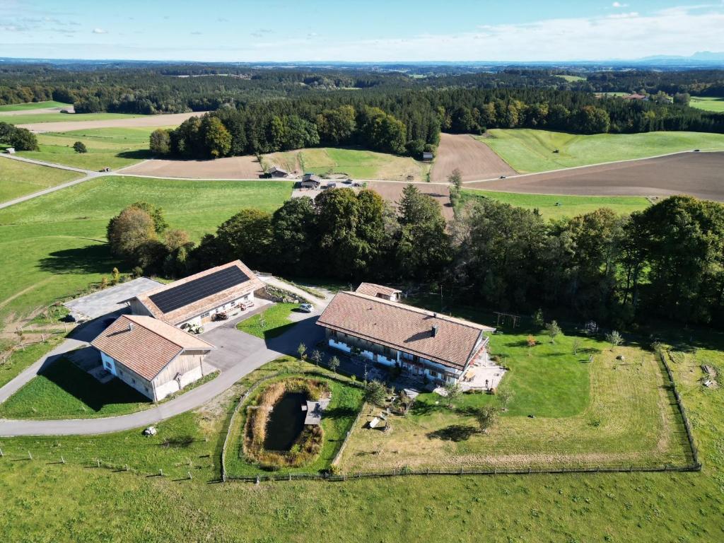 an aerial view of a large house in a field at Hof Kaltenbrunn in Aying