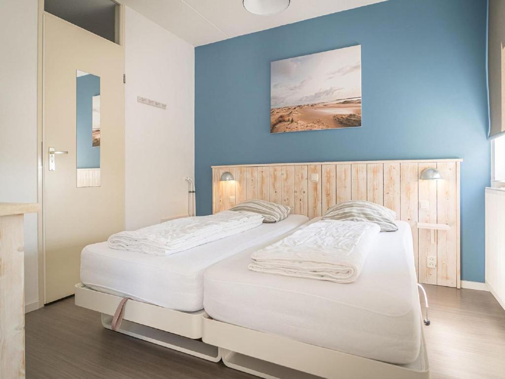 Ένα ή περισσότερα κρεβάτια σε δωμάτιο στο Texel Escape with Balcony