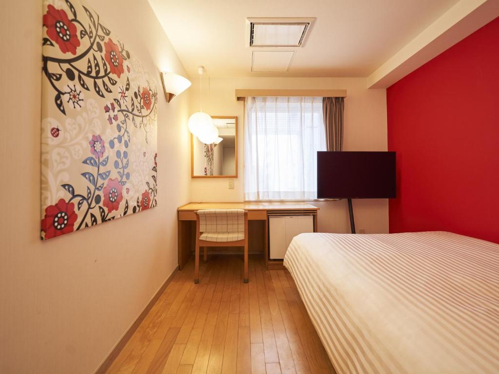 Postel nebo postele na pokoji v ubytování Hotel Toms