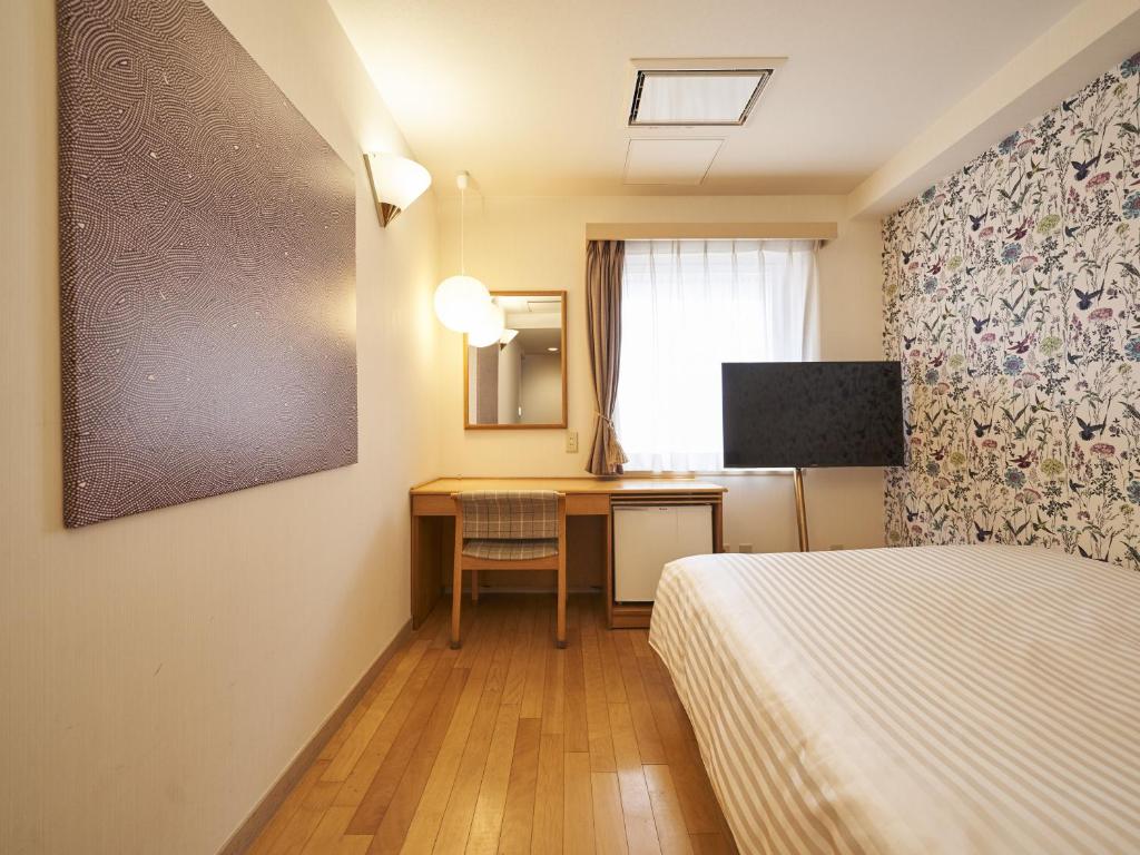 TV a/nebo společenská místnost v ubytování Hotel Toms