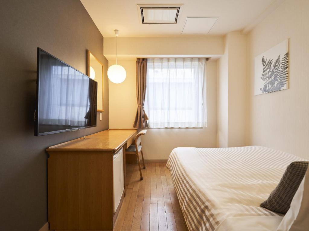 TV a/nebo společenská místnost v ubytování Hotel Toms