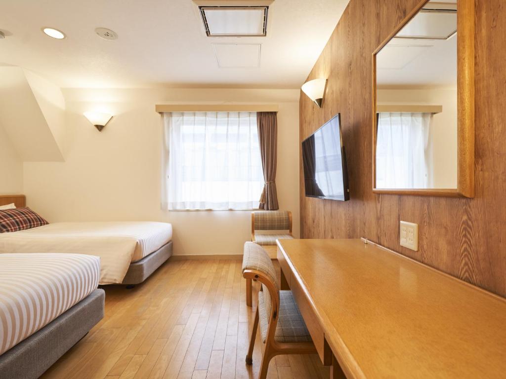 TV a/nebo společenská místnost v ubytování Hotel Toms