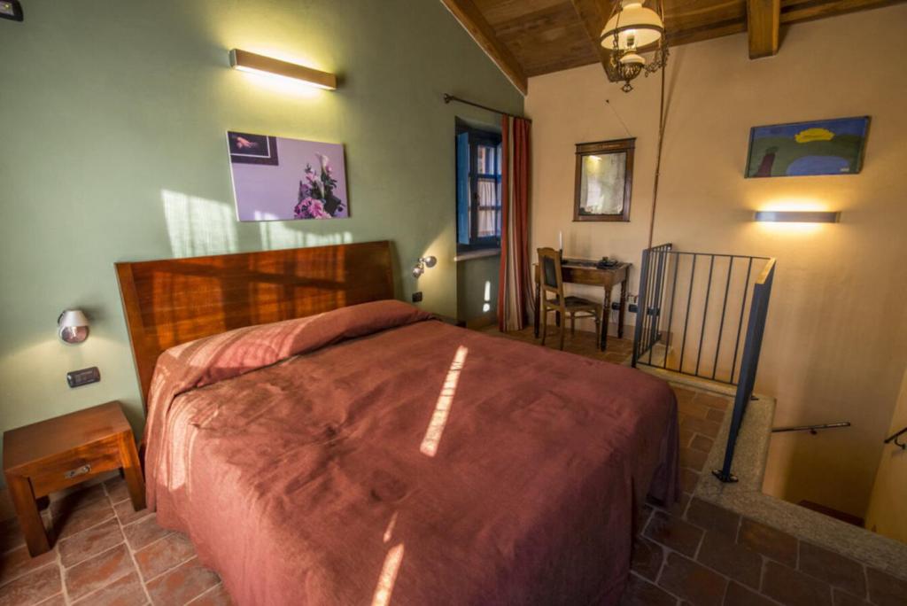 Postel nebo postele na pokoji v ubytování Albergo Ristorante Garibaldi