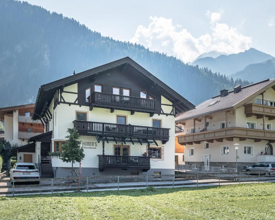 a building with balconies on the side of it at das Huber in Mayrhofen