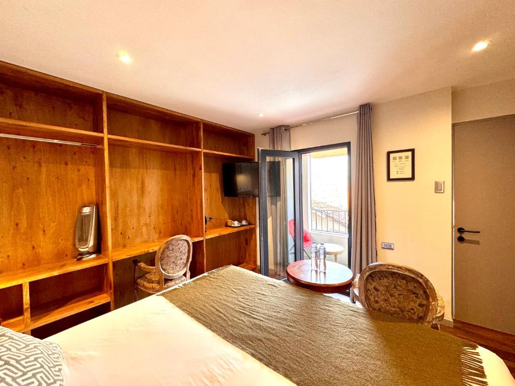 Postel nebo postele na pokoji v ubytování Hotel Montes Central