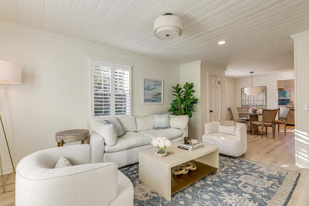a living room with a couch and a table at Walk Downtown and Canton Street Roswell Retreat! in Roswell