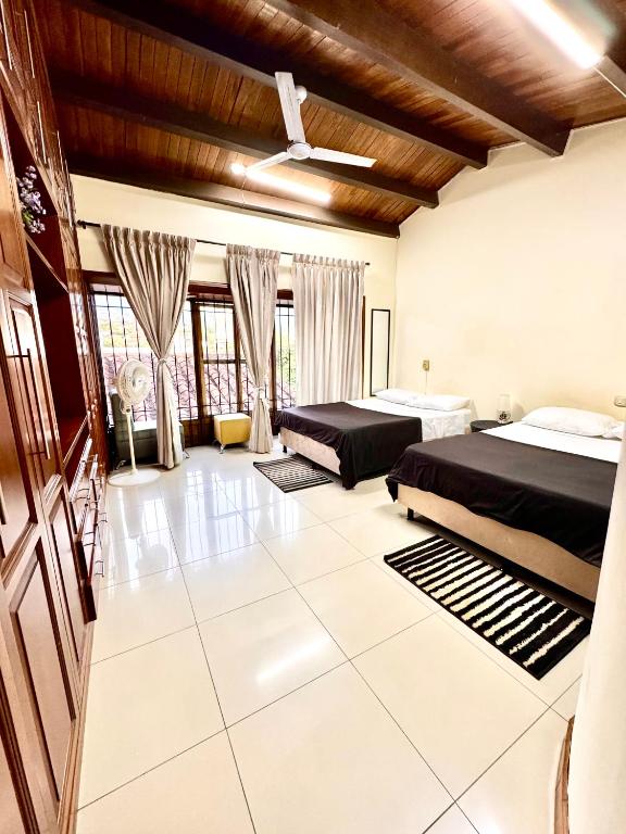 Postel nebo postele na pokoji v ubytování Ámbar Hostel San Gil