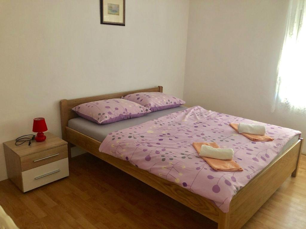 Posteľ alebo postele v izbe v ubytovaní Apartments Kate