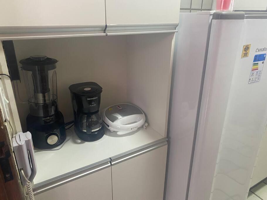 Cuisine ou kitchenette dans l'établissement Sua casa na Ponta Verde 200m da praia