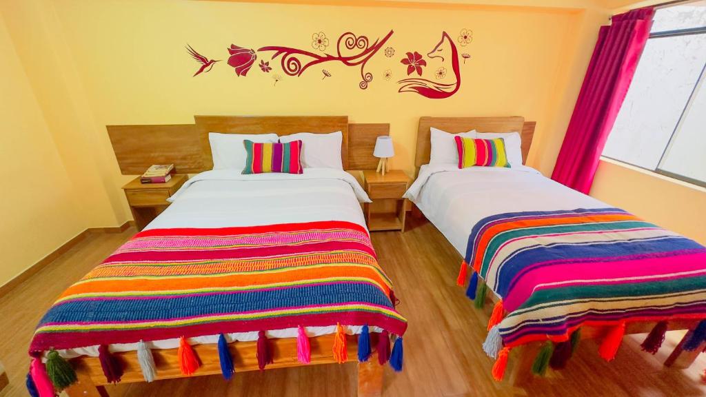 Postel nebo postele na pokoji v ubytování Andean Atoq Hostel