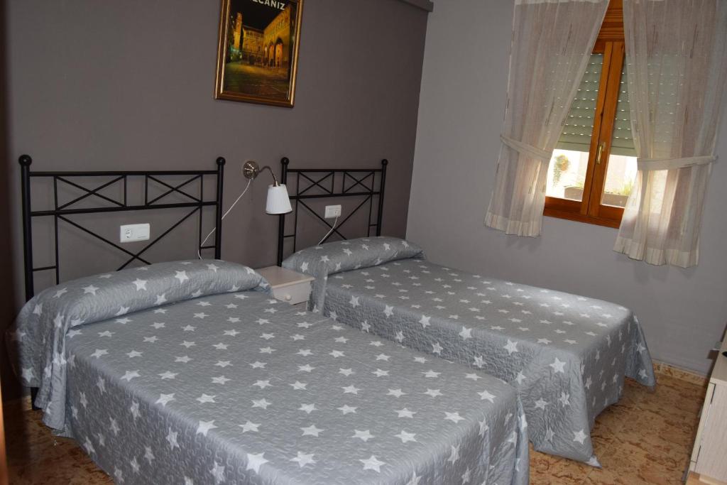 Postel nebo postele na pokoji v ubytování Casa Rural Javier