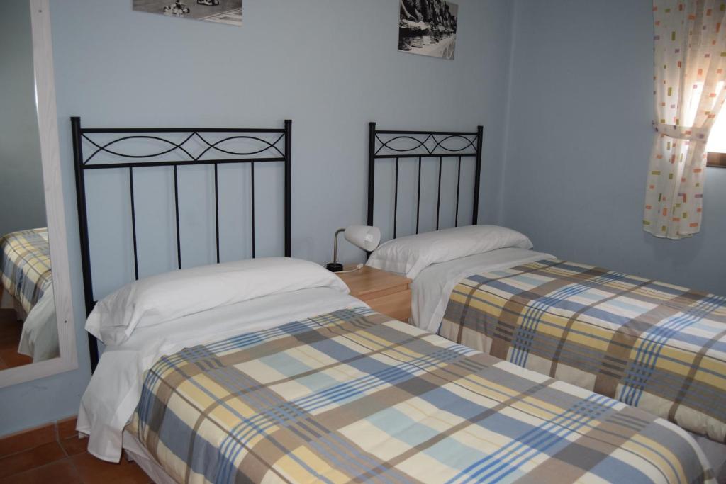 Postel nebo postele na pokoji v ubytování Casa Rural Javier