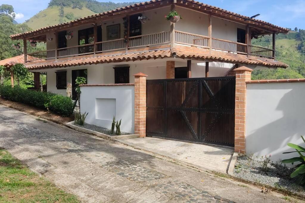 a house with a gate and a fence at Polandia in Villa Silvia