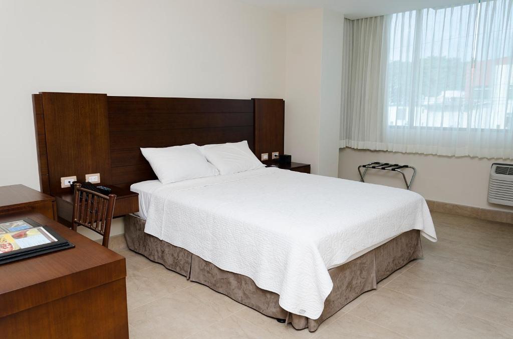 Postel nebo postele na pokoji v ubytování Hotel Marcelius