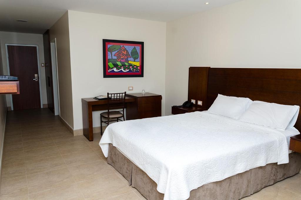 Postel nebo postele na pokoji v ubytování Hotel Marcelius