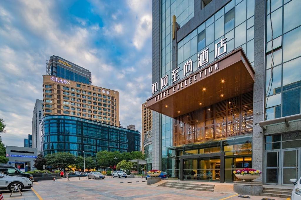 a group of buildings in a city with cars at Yitel Xi'an Hi-tech Zone Wanda Plaza in Xi'an