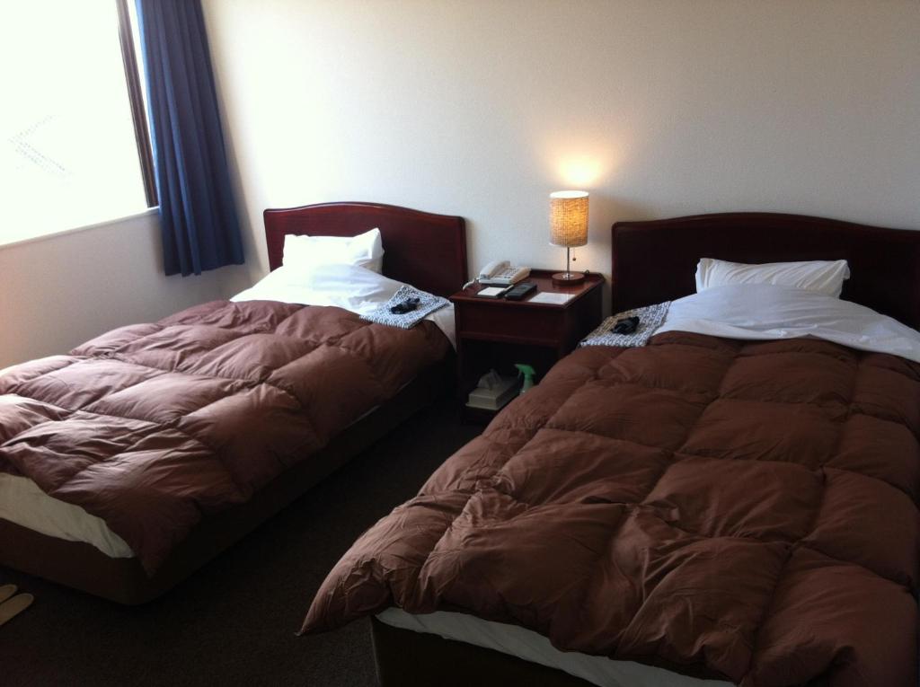 Postel nebo postele na pokoji v ubytování Prince Hotel Shimonoseki