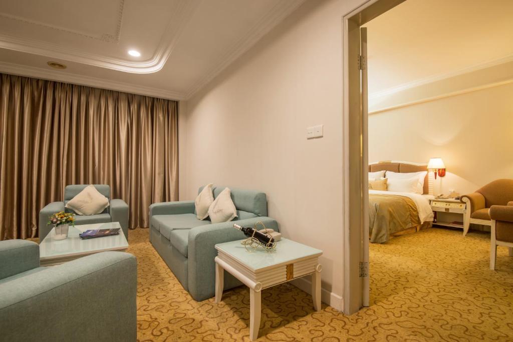 Postel nebo postele na pokoji v ubytování Panyu Hotel