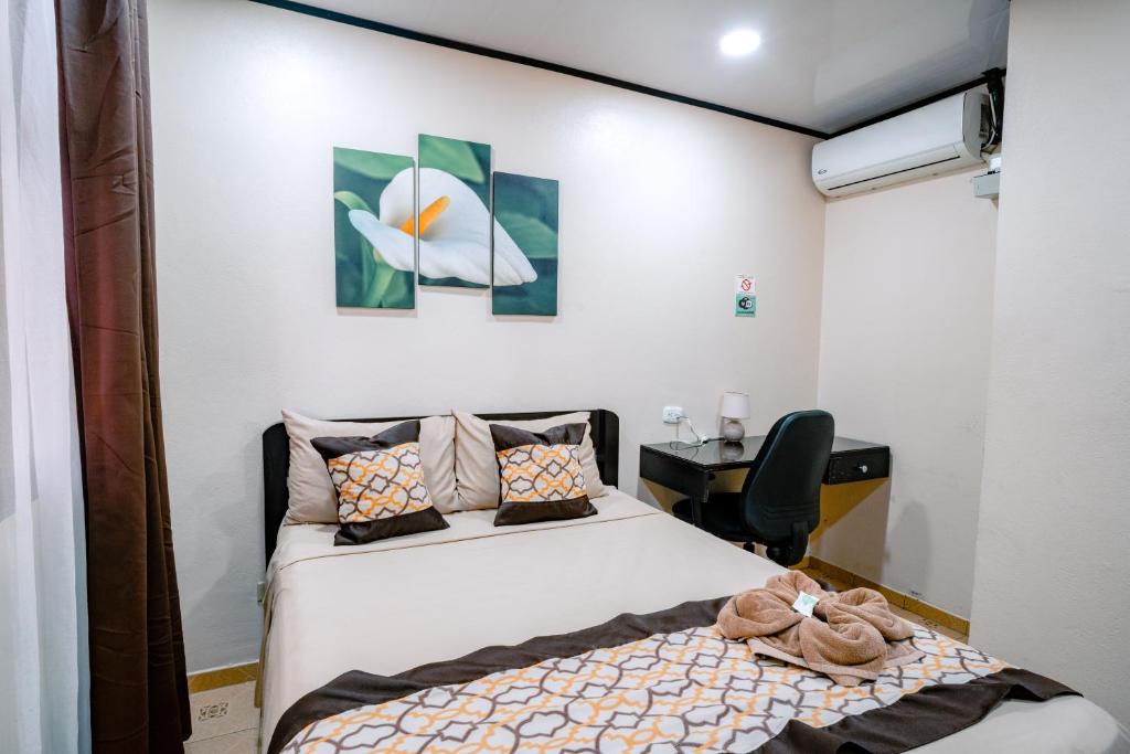 Postel nebo postele na pokoji v ubytování HOTEL DEL RiO