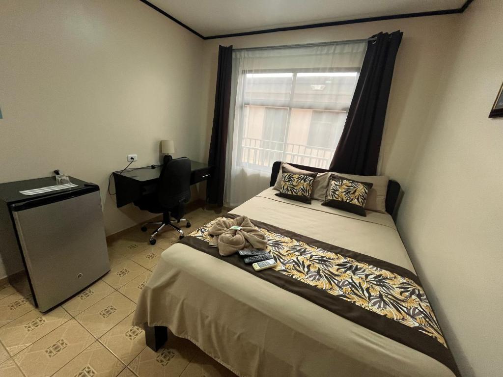 Postel nebo postele na pokoji v ubytování HOTEL DEL RiO