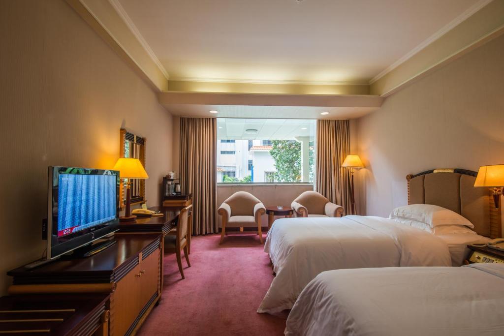 TV a/nebo společenská místnost v ubytování Panyu Hotel