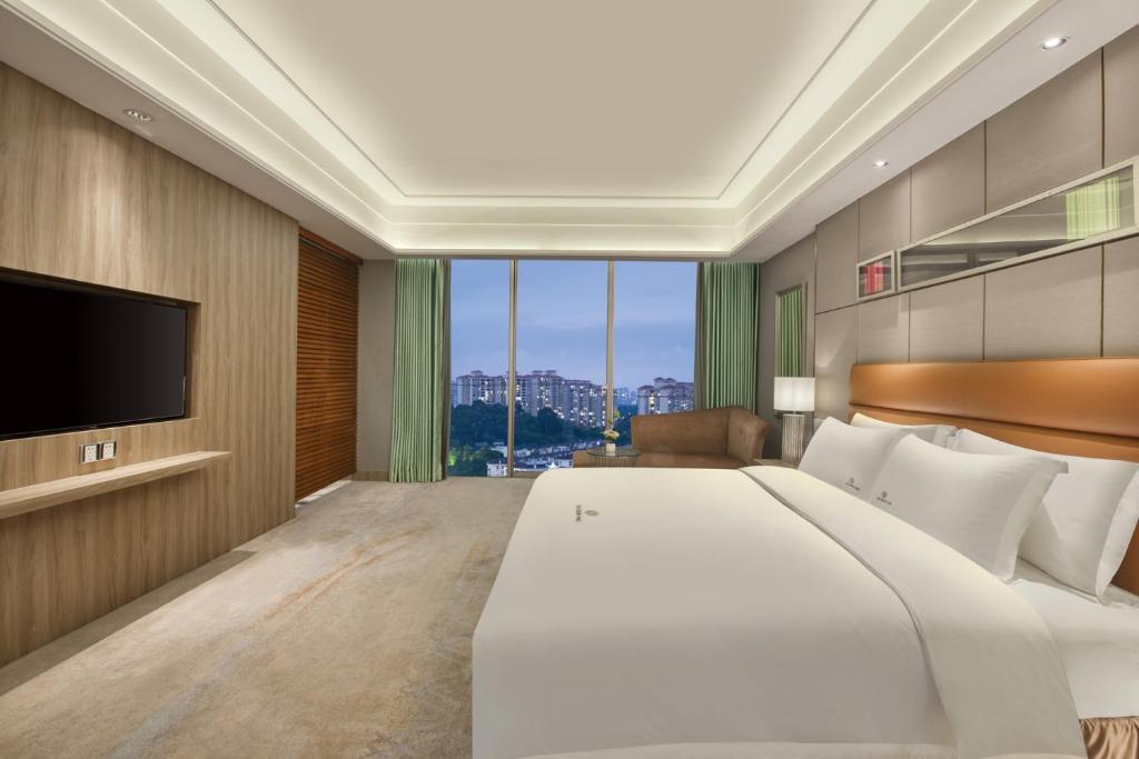 TV a/nebo společenská místnost v ubytování Dongguan Royal Garden Hotel