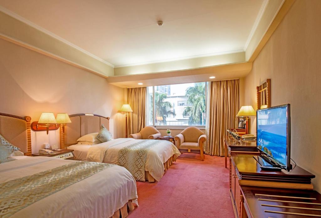 Postel nebo postele na pokoji v ubytování Panyu Hotel