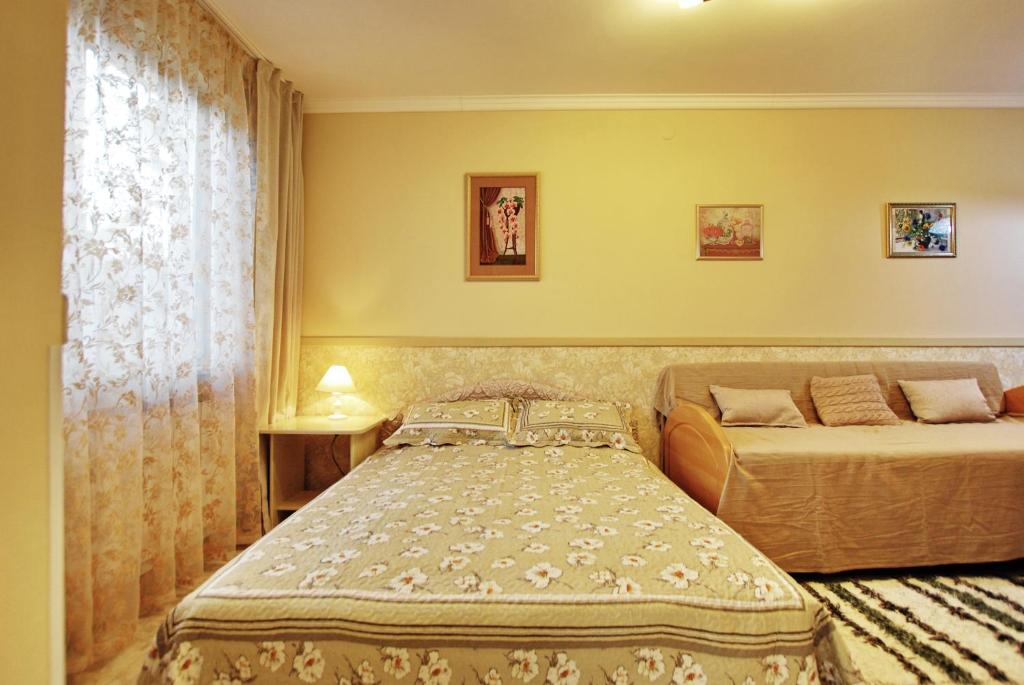 Postel nebo postele na pokoji v ubytování Aurora Ház