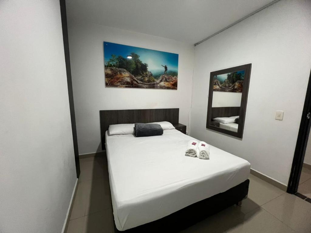 Postel nebo postele na pokoji v ubytování Hotel Jardin de Laureles Jeps