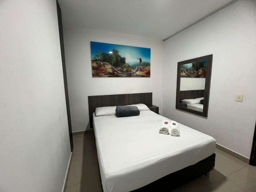 Postel nebo postele na pokoji v ubytování Hotel Jardin de Laureles Jeps