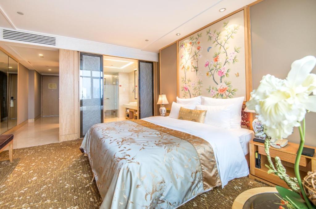 Postel nebo postele na pokoji v ubytování Panyu Hotel