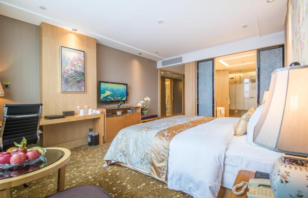 Postel nebo postele na pokoji v ubytování Panyu Hotel