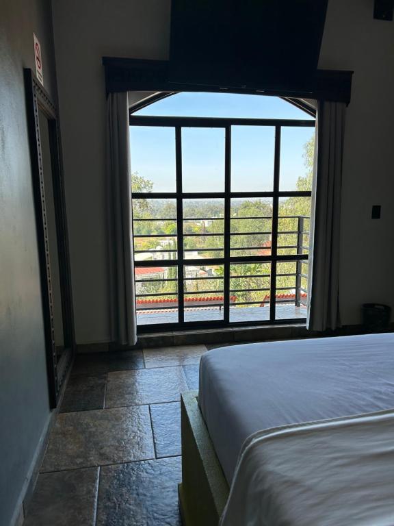 Postel nebo postele na pokoji v ubytování Hotel Villas Camargo