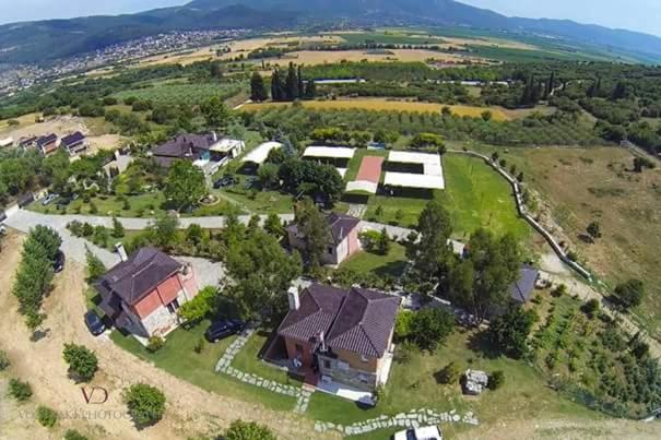 an aerial view of a house in a field at Ktima Papadopoulou in Krionérion