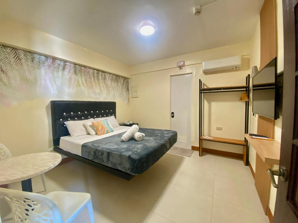 Postel nebo postele na pokoji v ubytování Boracay Grace Hotel