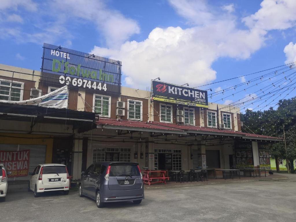 a car parked in a parking lot in front of a building at OYO 90473 Opah Inn Hotel in Jertih