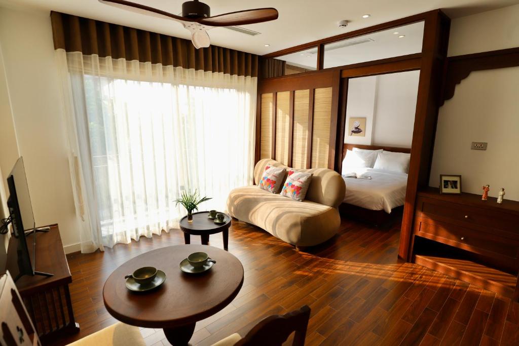 Postel nebo postele na pokoji v ubytování Maison Nhã 17 Tôn Thất Thiệp