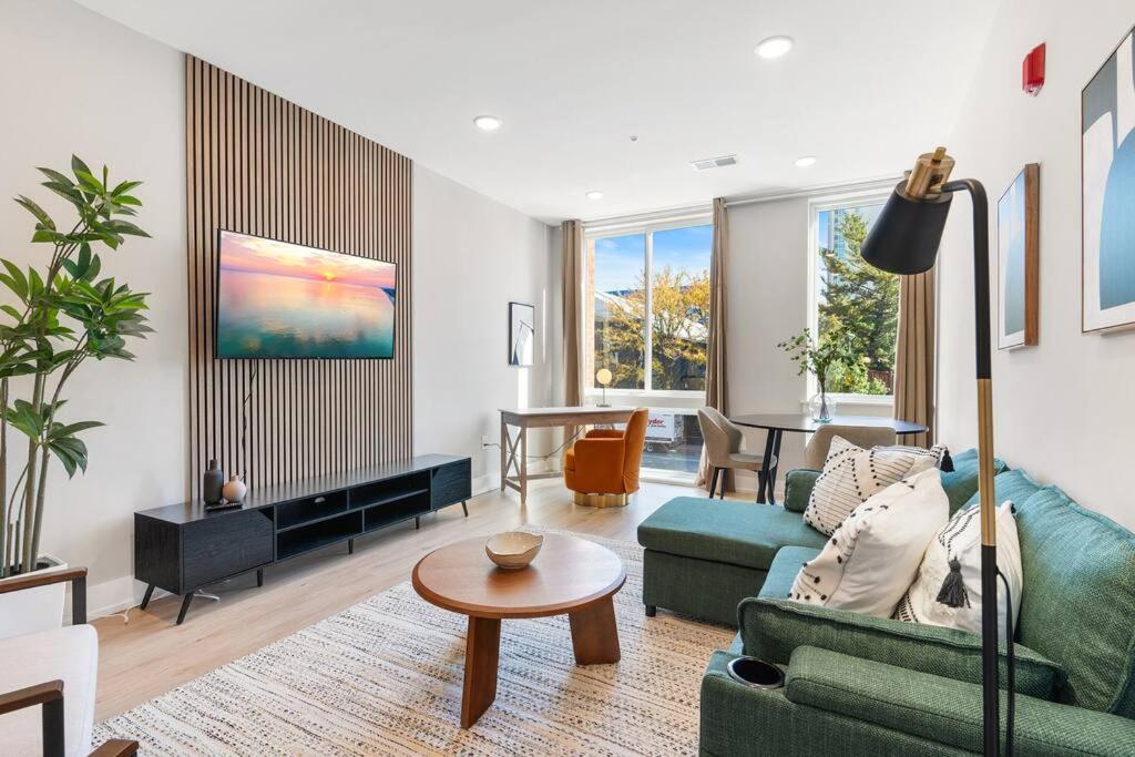 a living room with a couch and a table at King Bed - Stunning Pier Views - Near Fishtown in Philadelphia