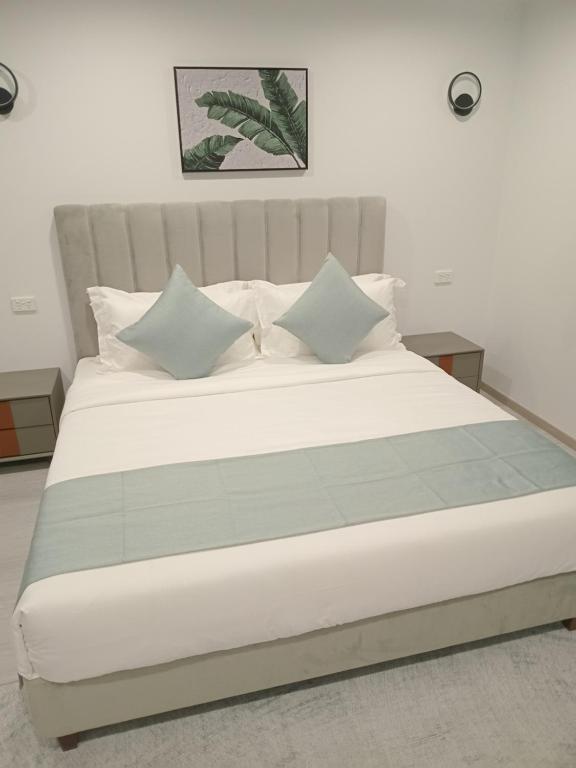 Letto o letti in una camera di Hibiscus Suites And Residences