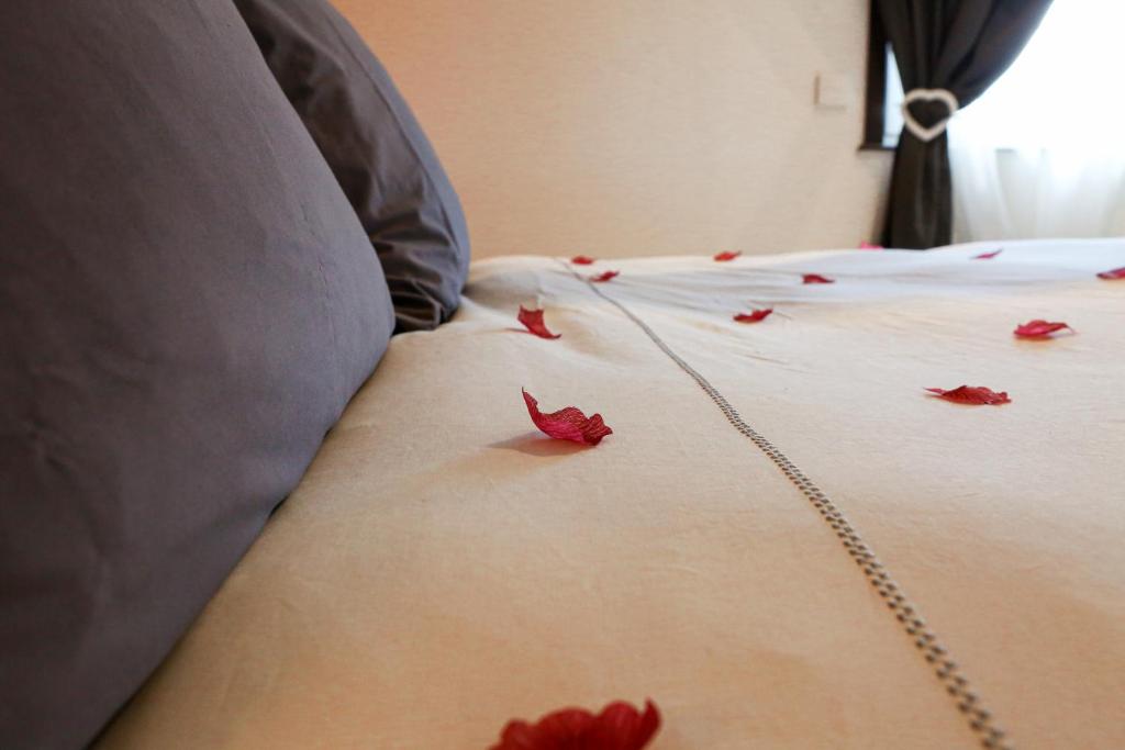 Postel nebo postele na pokoji v ubytování La Maisonnette Enchantée