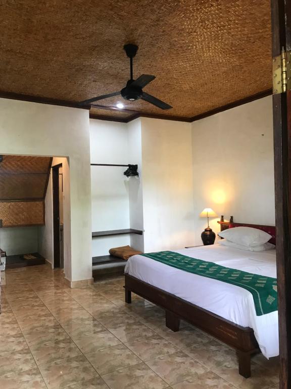 Postel nebo postele na pokoji v ubytování Anomcottages