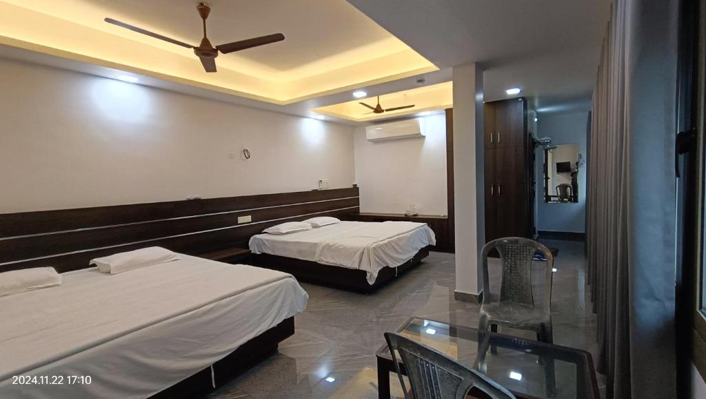 Postel nebo postele na pokoji v ubytování Aroma Serviced Villa Cochin