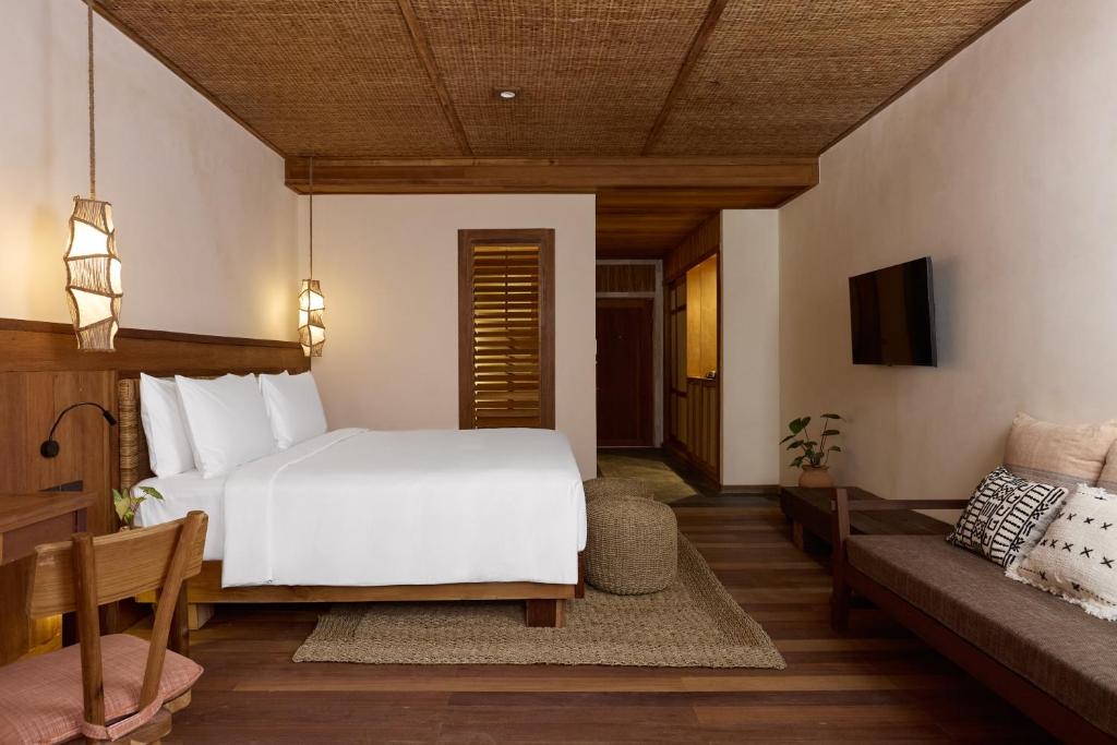 Postel nebo postele na pokoji v ubytování Vignette Collection Dinso Resort & Villas Ko Chang by IHG