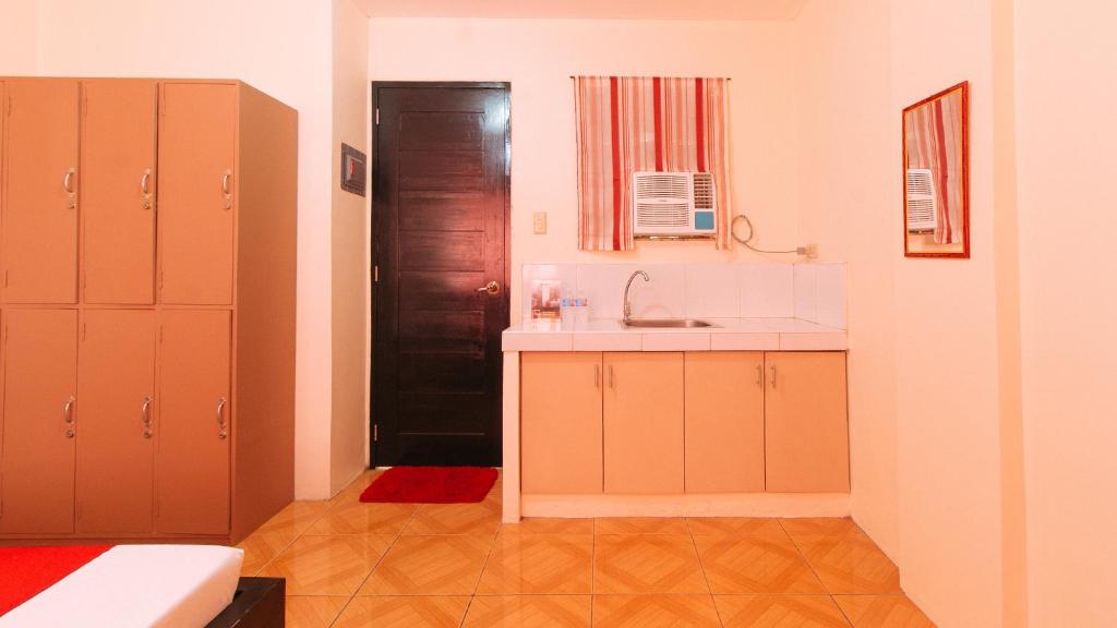 Fotografie z fotogalerie ubytování RedDoorz @ FDB Homes Nueva Ecija v destinaci Maria Aurora